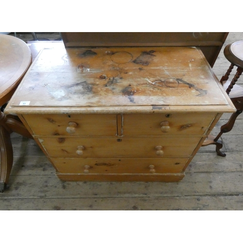 85 - A small pine chest of two short and two long drawers to a plinth base