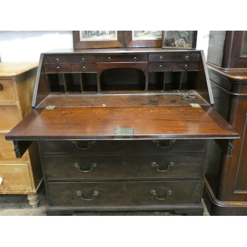 88 - A Georgian mahogany bureau with fitted interior and four long drawers under standing on bracket feet... 