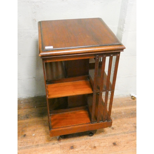 94 - An Edwardian revolving mahogany bookcase