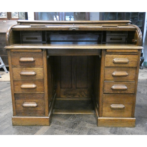 95 - An golden oak Tambour fronted roll top desk, 4' wide