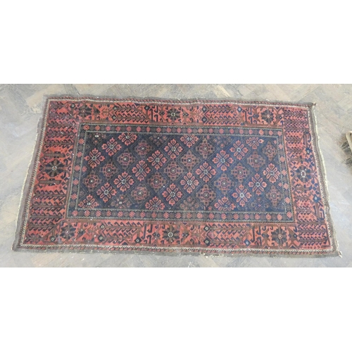 113E - A red and pattern wool pile Persian rug 5'7