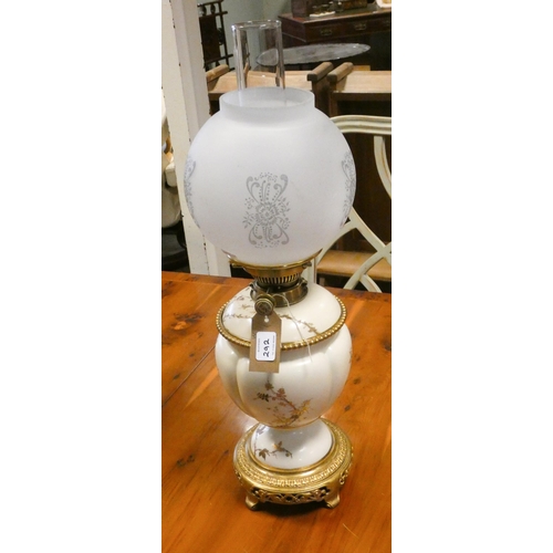 292 - Royal Worcester Victorian oil lamp, date letter for 1887, on gilt brass base with funnel and glass s... 