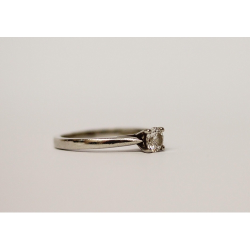 514 - A solitaire diamond engagement ring, the brilliant claw set diamond on hallmarked platinum band. Rin... 