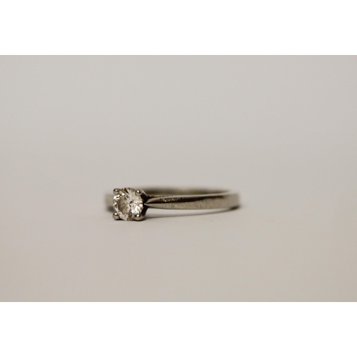 514 - A solitaire diamond engagement ring, the brilliant claw set diamond on hallmarked platinum band. Rin... 