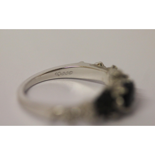 520 - Unusual sapphire Memento Mori ring, on 10k white gold band, ring size N, gross weight 5g