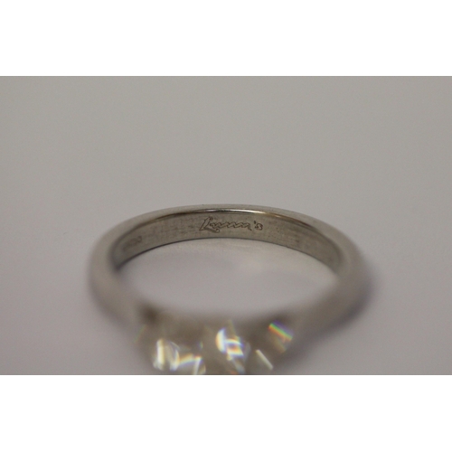 522 - A modern platinum and diamond three stone ring, hallmarked. Ring size L, weight 4.6g