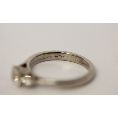 522 - A modern platinum and diamond three stone ring, hallmarked. Ring size L, weight 4.6g