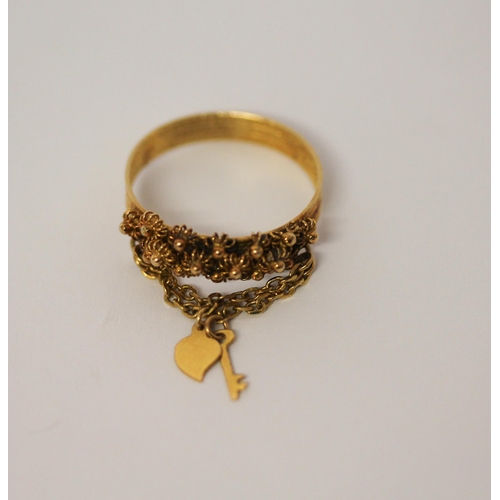 523 - High carat yellow gold cannetille dress ring with key to the heart attached. Ring size P, gross weig... 