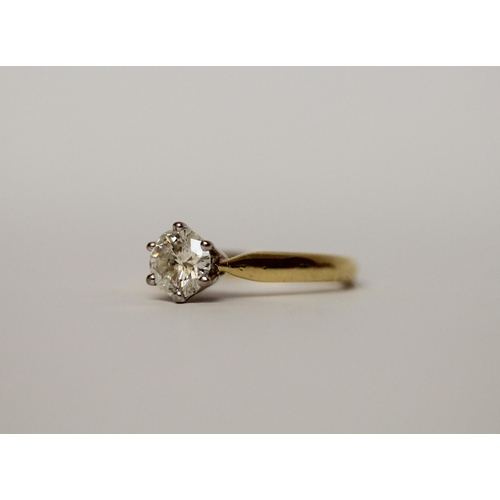 A diamond engagement ring, the solitaire brilliant cut diamond in claw ...