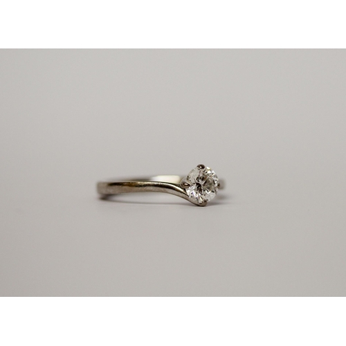 557 - A solitaire diamond ring - the brilliant cut diamond weighing 0.6 carat, colour F, Si1, with GIA cer... 