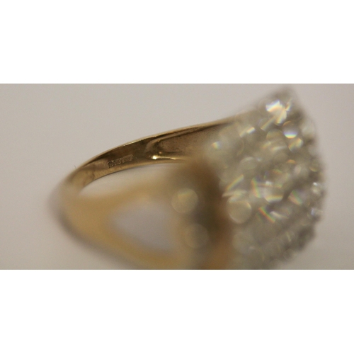 566 - A large square diamond panel ring, pave set with brilliant cut diamonds, on 9ct gold band. Marked 37... 