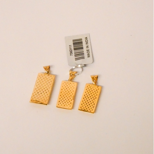 572 - Three modern gold 'ingot' pendants, one 9ct weighing 1.5g the other two marked  22k  3grams total.