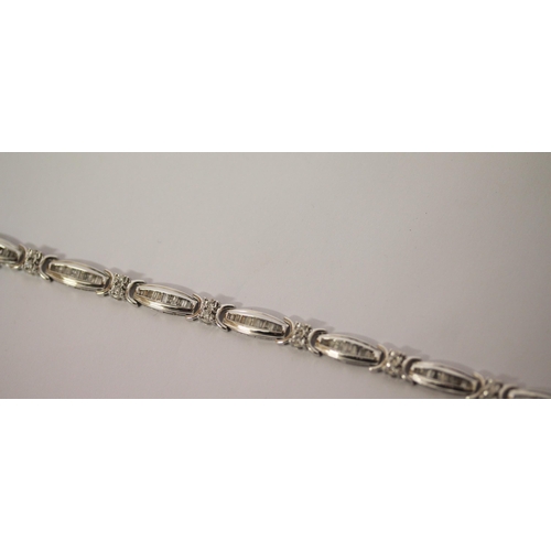 573 - Modern 10K white gold and diamond set oval panel link bracelet, set with two carats of diamonds, in ... 