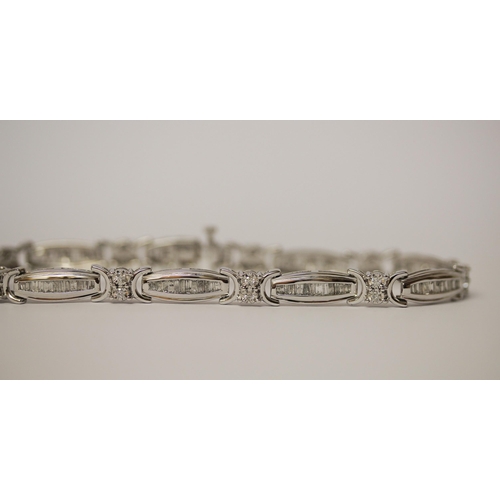 573 - Modern 10K white gold and diamond set oval panel link bracelet, set with two carats of diamonds, in ... 