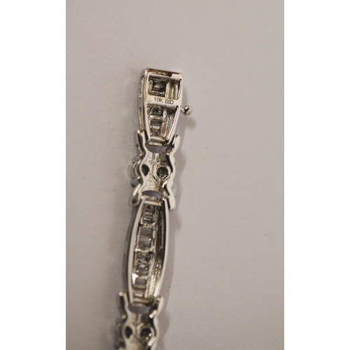 573 - Modern 10K white gold and diamond set oval panel link bracelet, set with two carats of diamonds, in ... 