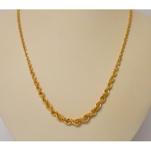 578 - A long graduated 9ct gold rope link necklace, unworn with tag still attached. 9.2g