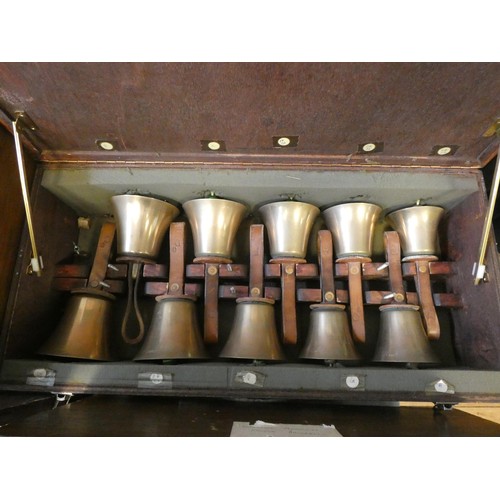 685 - 52 early 20th century campanology hand bells with leather straps, all contained within six wooden fi... 