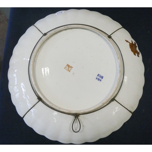 295 - A large circular Famille Rose porcelain charger, 18