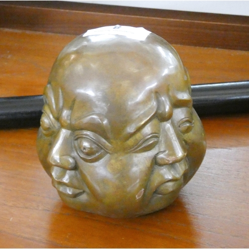 18 - A four faced bronze Buddha head paperweight...