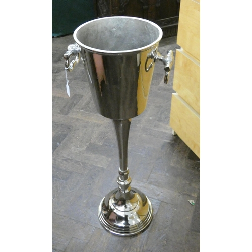 51 - A floor standing polished aluminium  wine cooler...