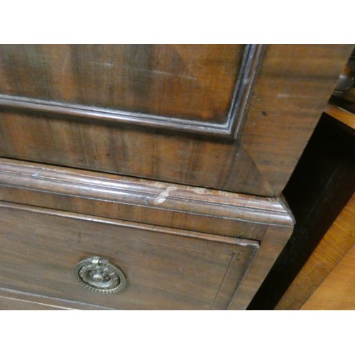 185 - A Georgian mahogany linen press, two shell inlaid cupboard doors with sliders within on a two short ... 