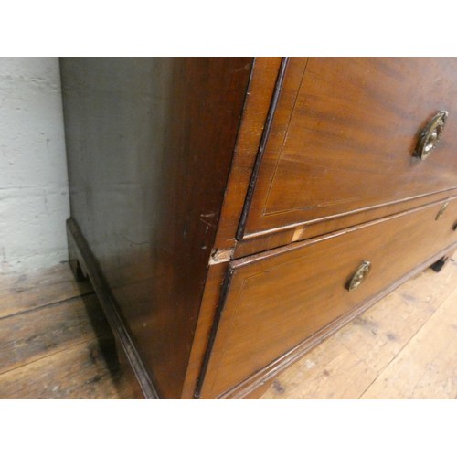 185 - A Georgian mahogany linen press, two shell inlaid cupboard doors with sliders within on a two short ... 