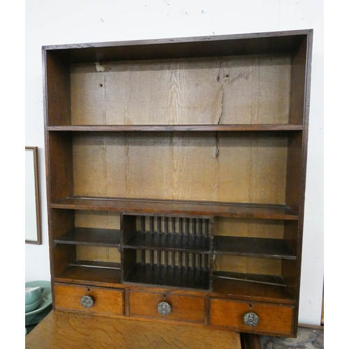 20 - A set of oak wall hanging shelves with three drawers, 34