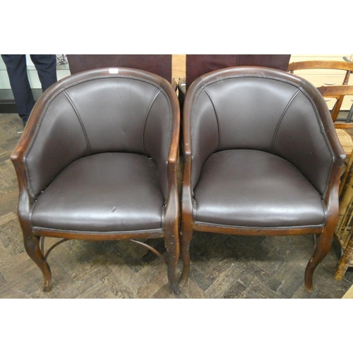 3 - A pair of mahogany framed tub shaped elbow chairs in brown leather standing on cabriole style legs...