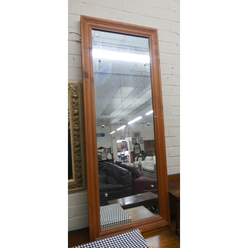 35 - A long pine framed wall mirror...