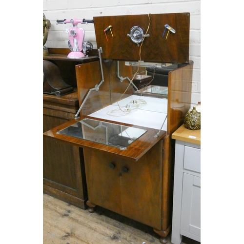 42 - A walnut cocktail cabinet with cupboards under, 2'3 wide...