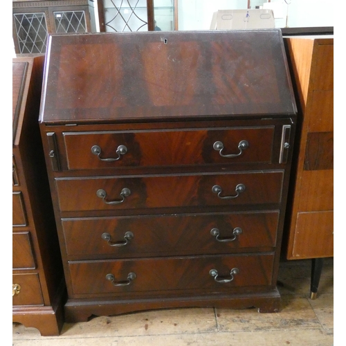 29 - A Georgian style mahogany bureau with three long drawers under, 2'6 wide