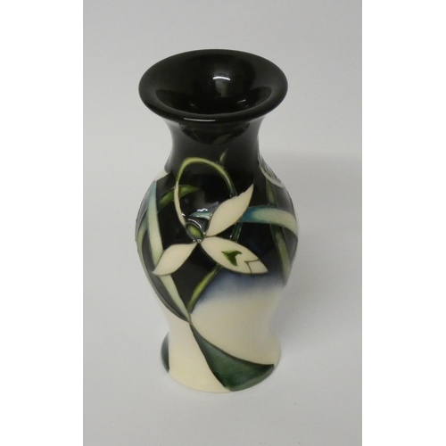 208 - A Moorcroft vase decorated in Twenty Winters pattern with stylised snowdrops, impressed marks and da... 