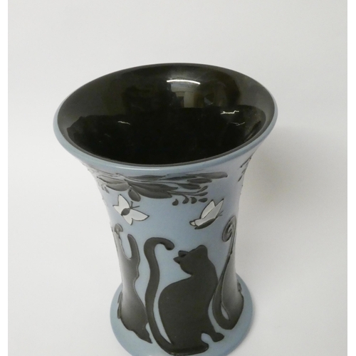 209 - A Moorcroft vase decorated with The Lucky Black Cat pattern, designed by Paul Hillditch, dated 2014