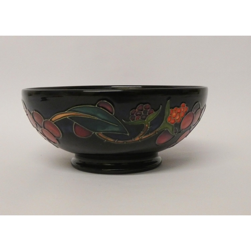 211 - A Moorcroft shallow bowl decorated in the Queen's Choice pattern with figs and grapes, dated 2000, i... 