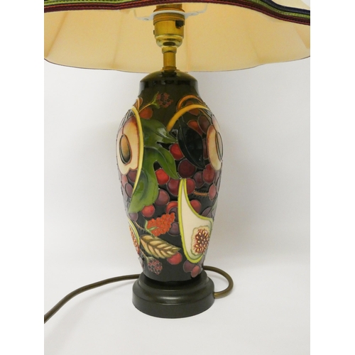 213 - A Moorcroft lamp base decorated with figs and autumnal fruit in the Queen's Choice pattern