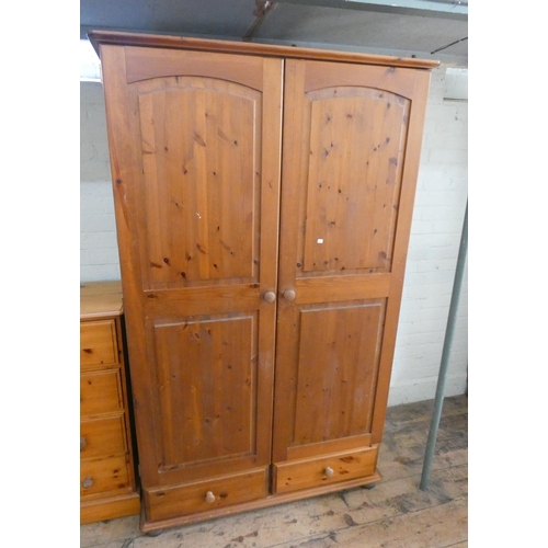 14 - A pine two door wardrobe with two drawers under, 3'6 wide