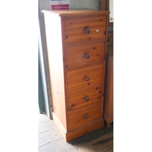 2 - A modern pine tallboy chest of five drawers with knob handles, 17