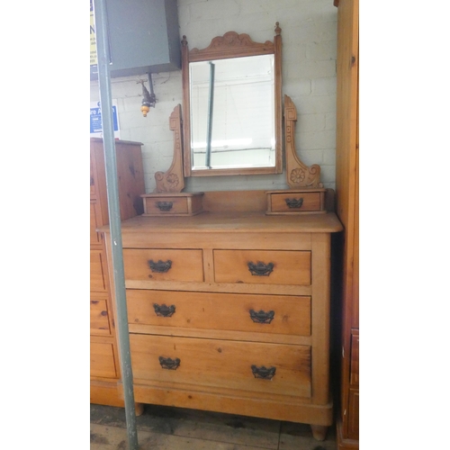 5 - A late Victorian stripped pine dressing chest, fitted two long and two short drawers with swing mirr... 