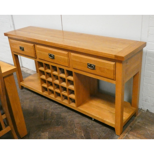 116 - A good quality modern light oak sideboard fitted three drawers, open base with wine rack centre, 6' ... 