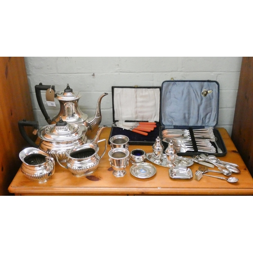 13 - A four piece plated tea and coffee set, fish knives and forks, cake knives, condiments etc