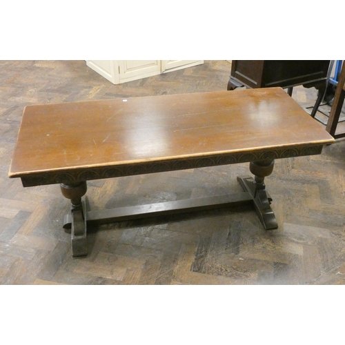 132 - A long oak refectory style coffee table