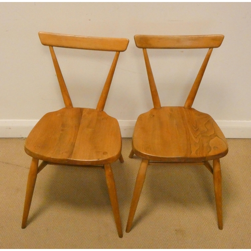 149 - Ercol - A pair of blonde original stacking chairs