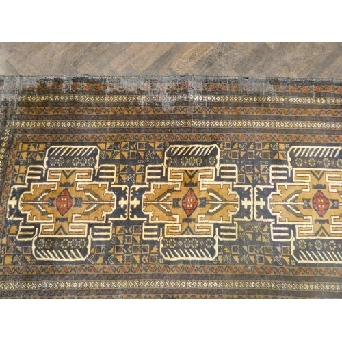 298 - An antique blue and patterned Persian rug with geometric central design, 86