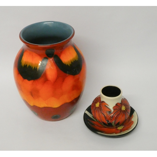 201 - A large modern Poole Pottery vase and two small pieces of Moorcroft decorated in a Poinsettia patter... 