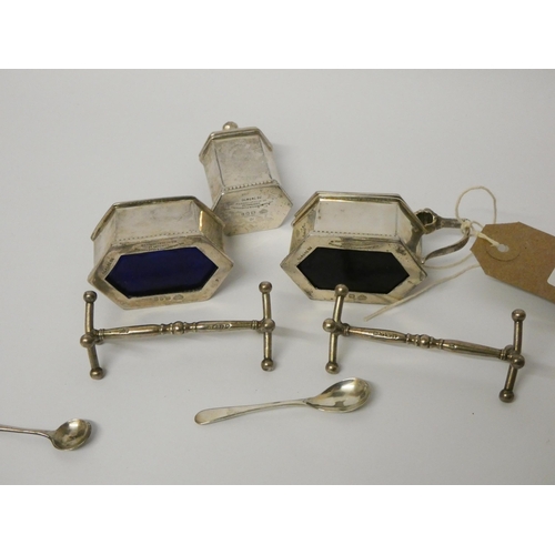 652 - A pair of 19th century silver knife rests, London 1833/34 and a three piece silver cruet set with bl... 