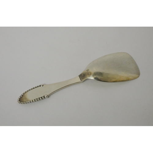 657 - A Georg Jensen silver beaded pattern caddy spoon, stamped marks, 830S HCF