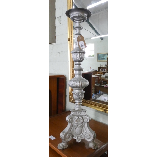 102 - A heavy brass silver painted pricket candle stick on paw feet, 2' high overall