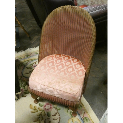 140 - A pink Lloyd loom bedroom chair with upholstered sprung seat