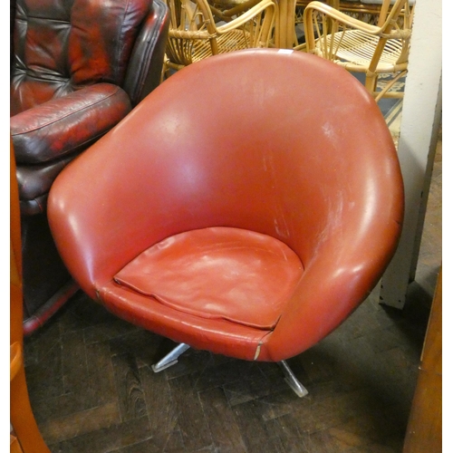 142 - A 1960's style tub shaped easy chair on chrome base