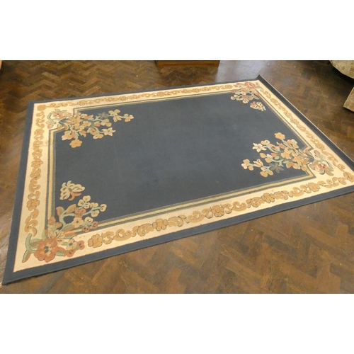 144 - A blue, cream and floral patterned Axminster rug, 9'4 X 6'3